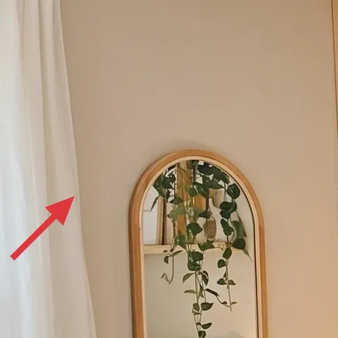white curtain panel (left window)