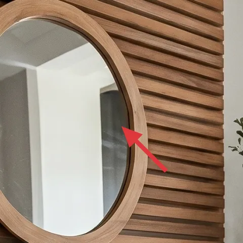 oval mirror with light wood frame